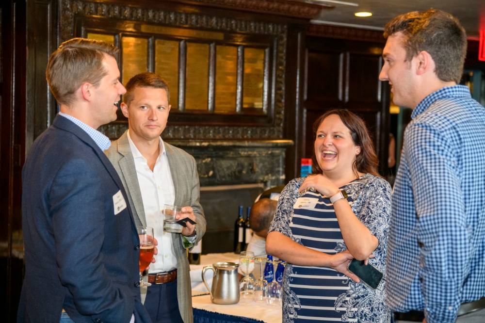 Guests gather after event to network